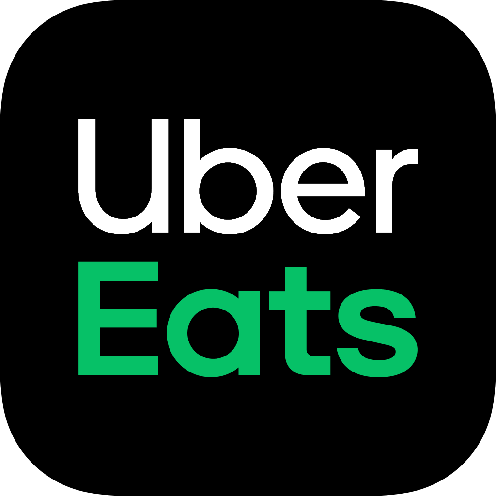 Das Uber Eats Logo zeigt weisse und gruene Schrift vor schwarzem Hintergrund